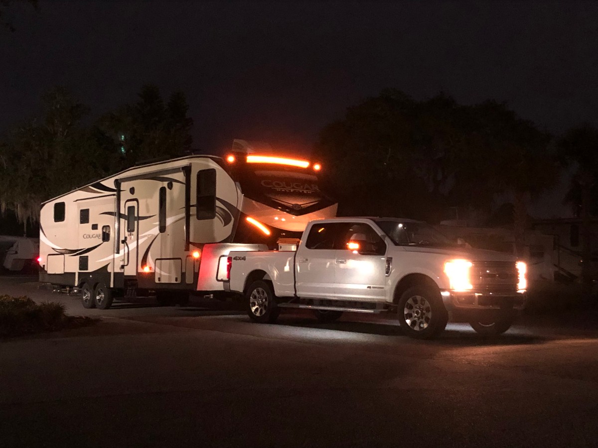 a white car with a fire truck on top of it