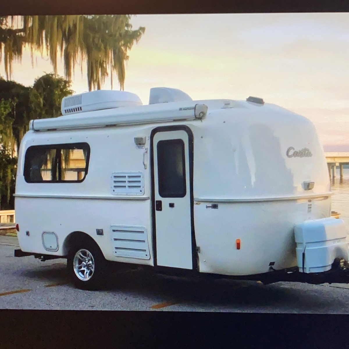 a white camper parked on a street