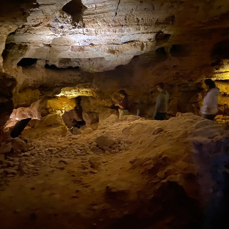 people inside a cave