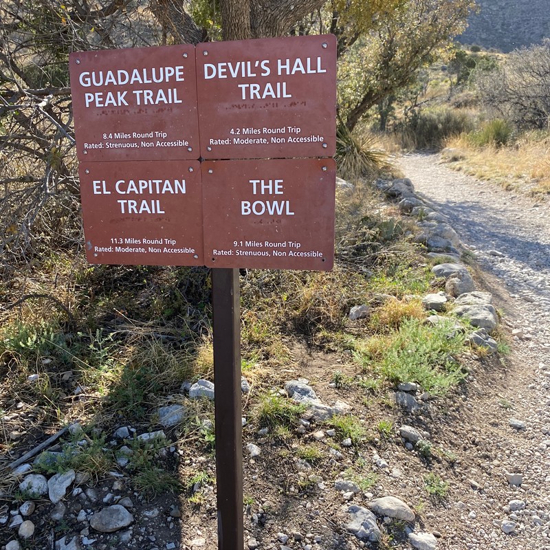 a sign on a trail