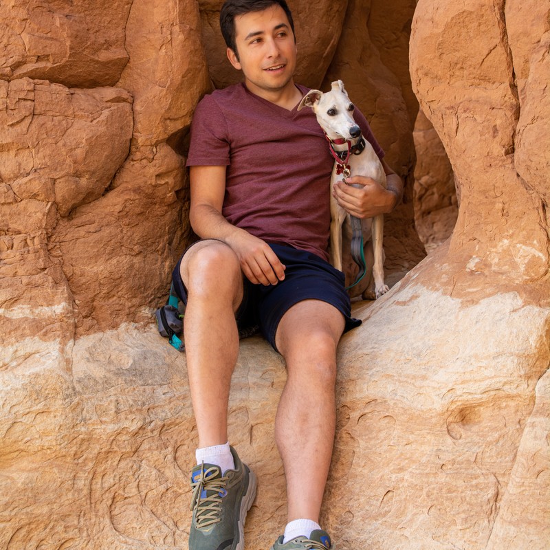 a man holding a dog
