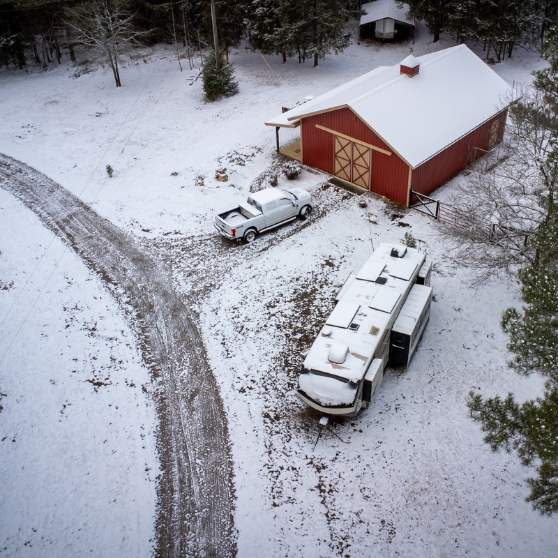 a group of cars parked in a snowy area