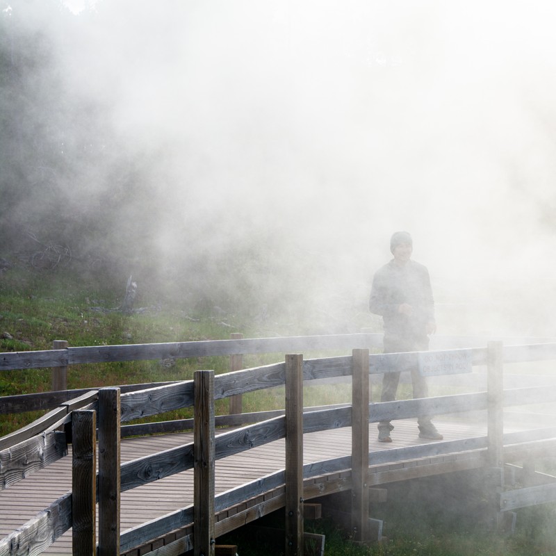 a person standing on a bridge