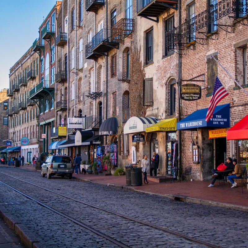 a street with buildings and people