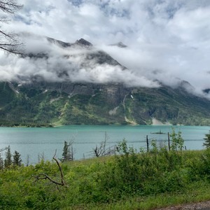 a lake with mountains in the background