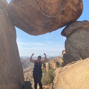 a person standing in a rock formation