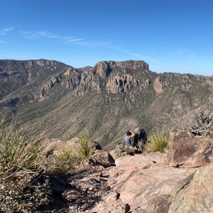 a person standing on a rocky hill