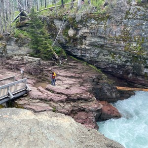 a person standing on a rock ledge