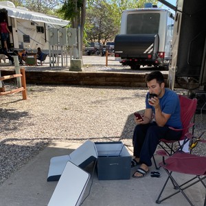 a person sitting outside on a chair