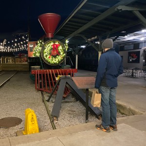 a man looking at a large clock