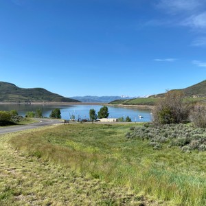 a road next to a body of water