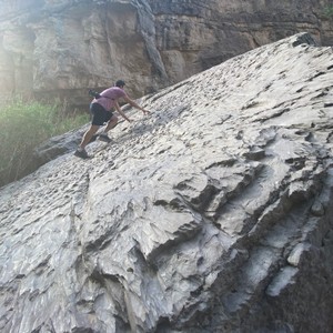 a man climbing a rock