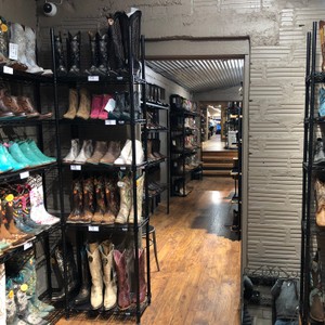 a room with shelves of shoes