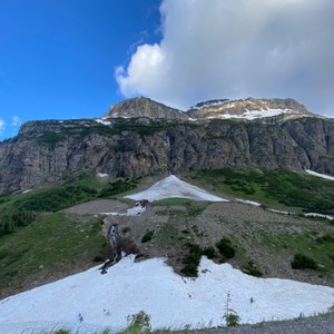 a rocky mountain with snow