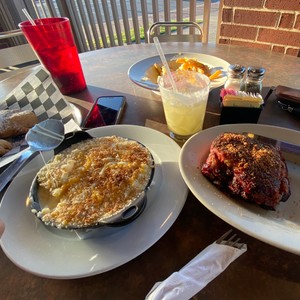 a table with plates of food and drinks on it