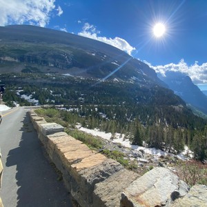 a road with a mountain in the background