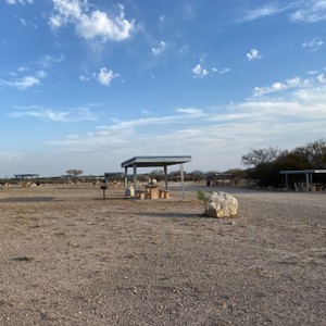 a structure outside with a rock in the front