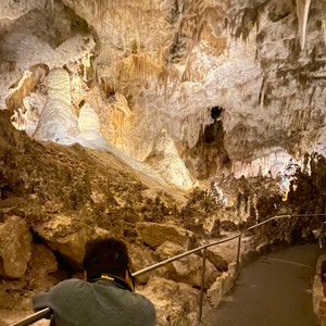 a person looking at a cave