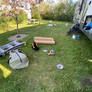 a group of camping supplies on the grass