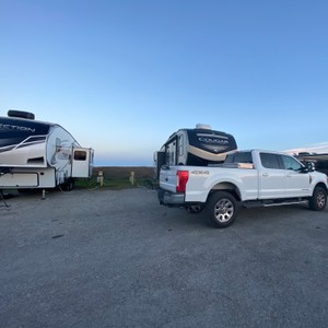 a white truck with a trailer