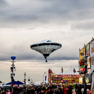 a large crowd of people at a fair