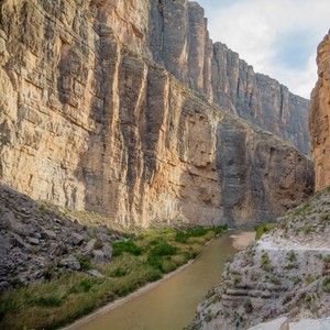 a river running between rocky cliffs