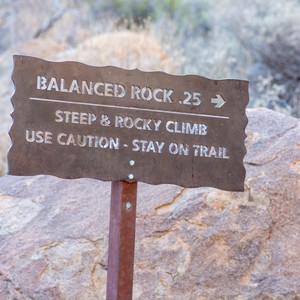 a sign on a rock