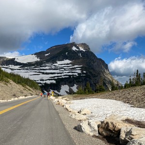 a road with a mountain in the background