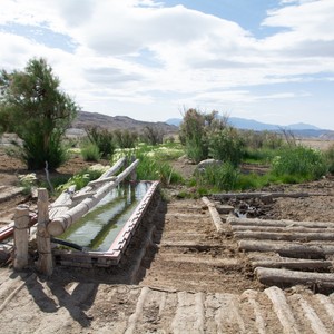 a wooden bench on a hill