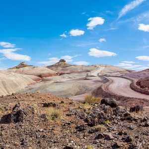 a desert landscape with a blue sky