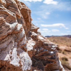 a rocky canyon with a blue sky