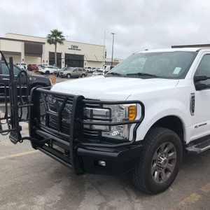 a white truck parked in a parking lot