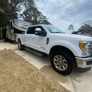 a white truck parked on a driveway