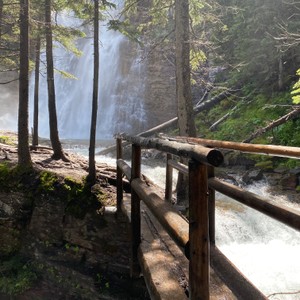 a wooden bridge over a river