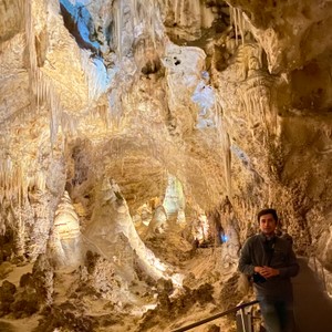 a person standing in a cave