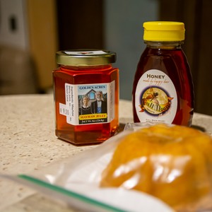 a group of jars with food in them