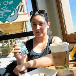 a woman holding a bottle of water