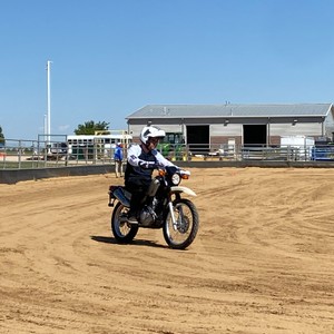 a man riding a motorcycle on a dirt track