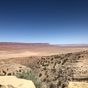 a desert landscape with a blue sky