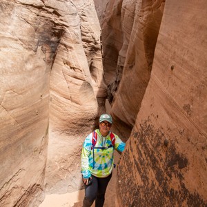 a person standing in a canyon