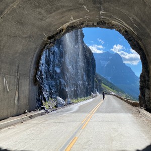 a person walking through a tunnel