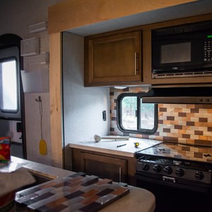 a kitchen with a microwave oven and a microwave