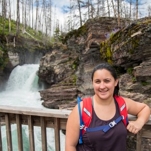 a person standing in front of a waterfall