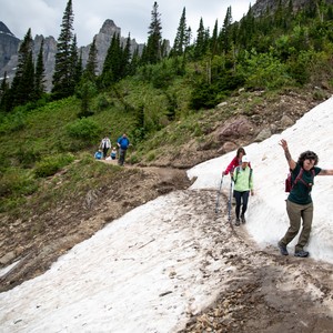 a group of people hiking up a mountain