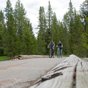 two people riding bikes