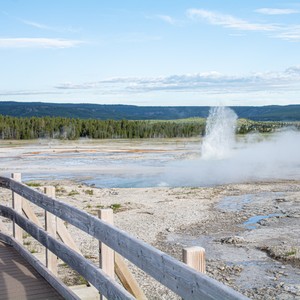 a large geyser in a lake