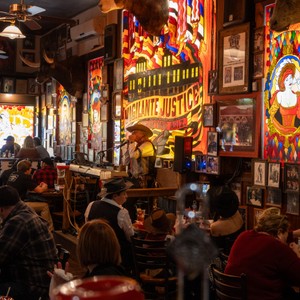 a group of people sitting in a bar